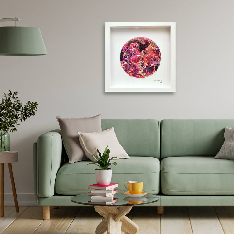 Pink beaded embroidery by artist Emily Richardson in a stylish home setting