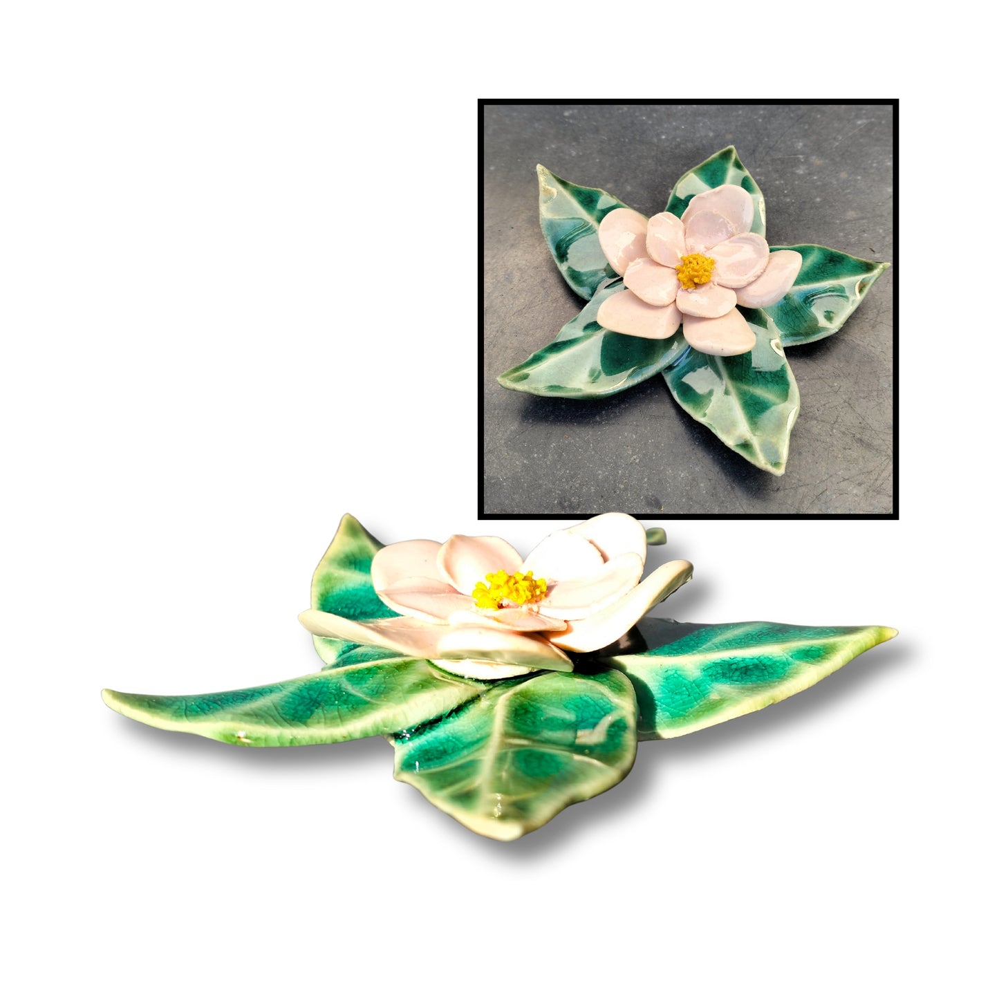 Pink ceramic camellia wall flower with five sculpted green leaves and glossy finish.