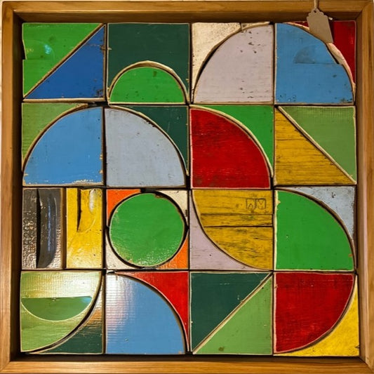 Geometric artwork Bee’haus #10 by Lee Pritchard made from salvaged beehive wood in a rimu frame, 16 colourful panels in a grid