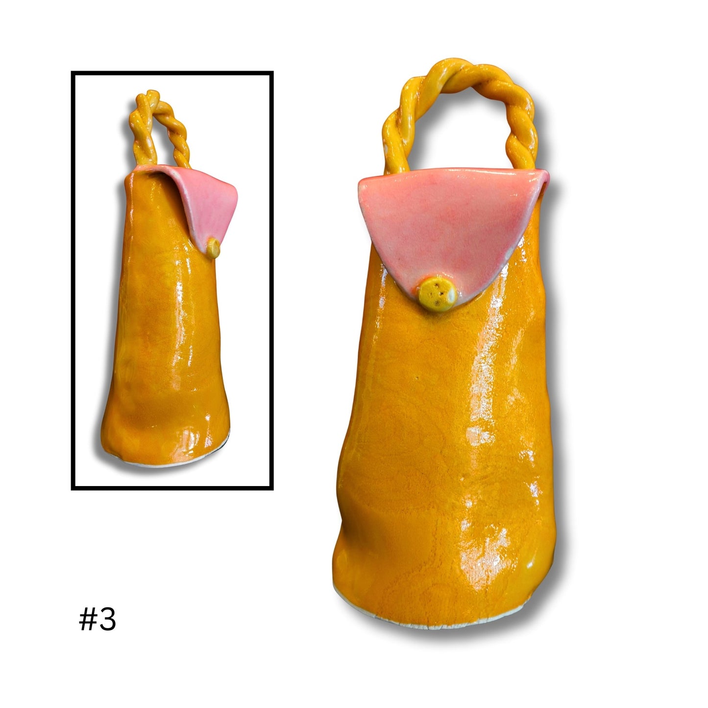 Orange ceramic bag with pink flap and yellow handle on a white background