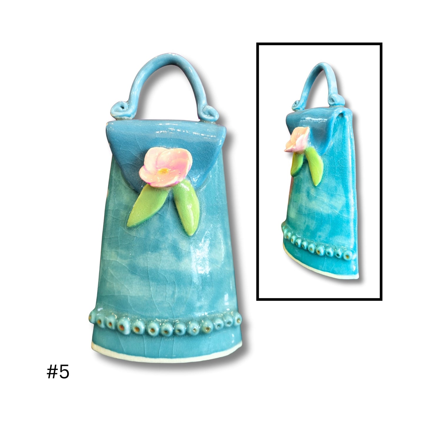 Blue ceramic decorative bag with floral design on a white background