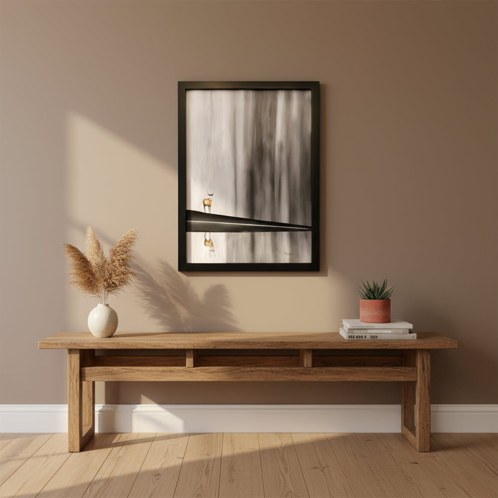 Stagnant - atmospheric oil painting by Marion Aitken featuring a deer in soft greys and warm tones with misty forest background, black frame- above a woden side table in the home