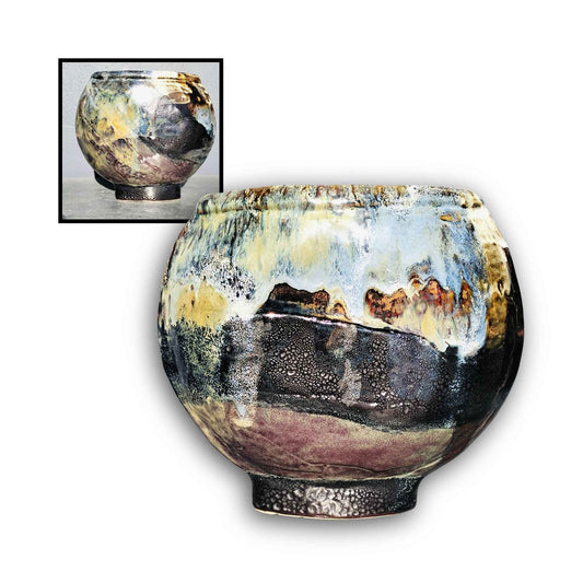 Handmade ceramic vase by Storm Davenport with rounded asymmetric form and layered black, blue, and earthy glaze in an abstract design