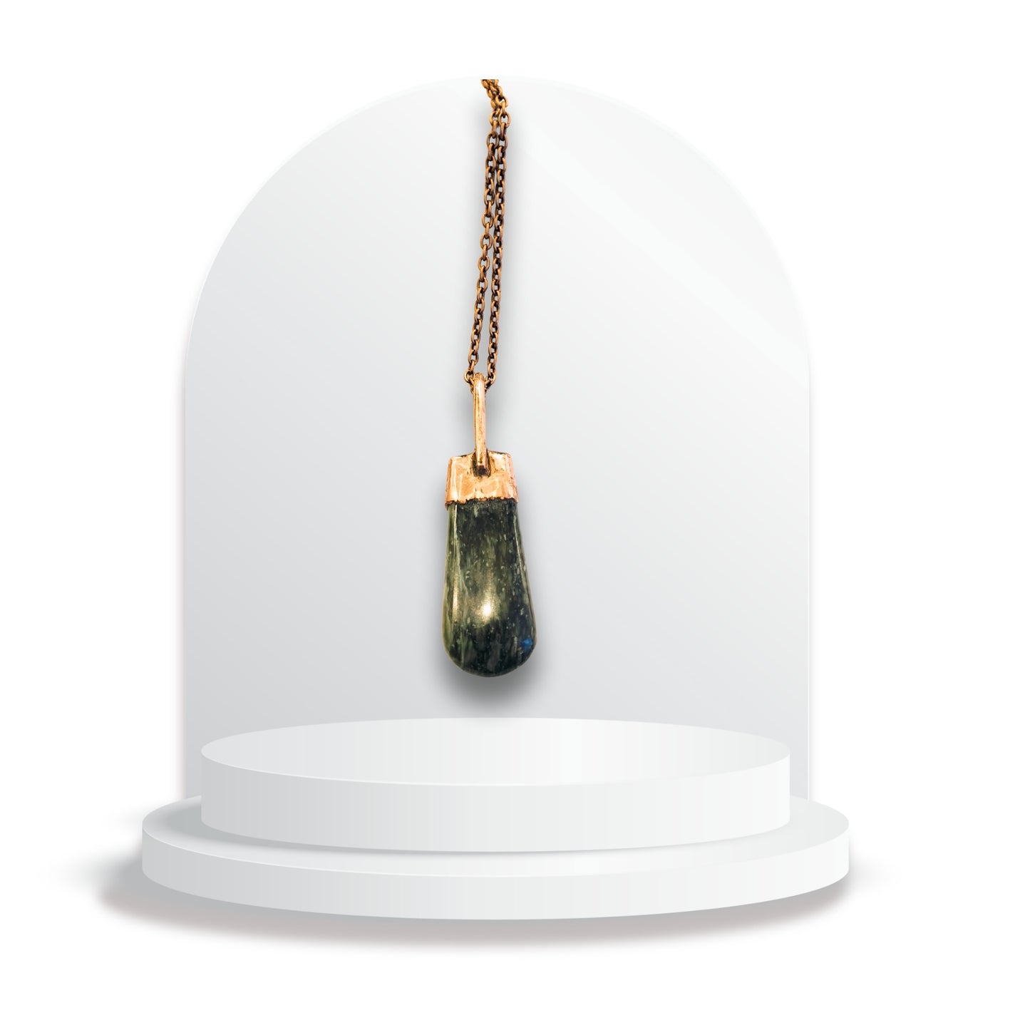 Copper and greenstone pendant by Gary Howse displayed on a white jewellery stand, showing the natural greenstone framed by a warm copper cap and bail.