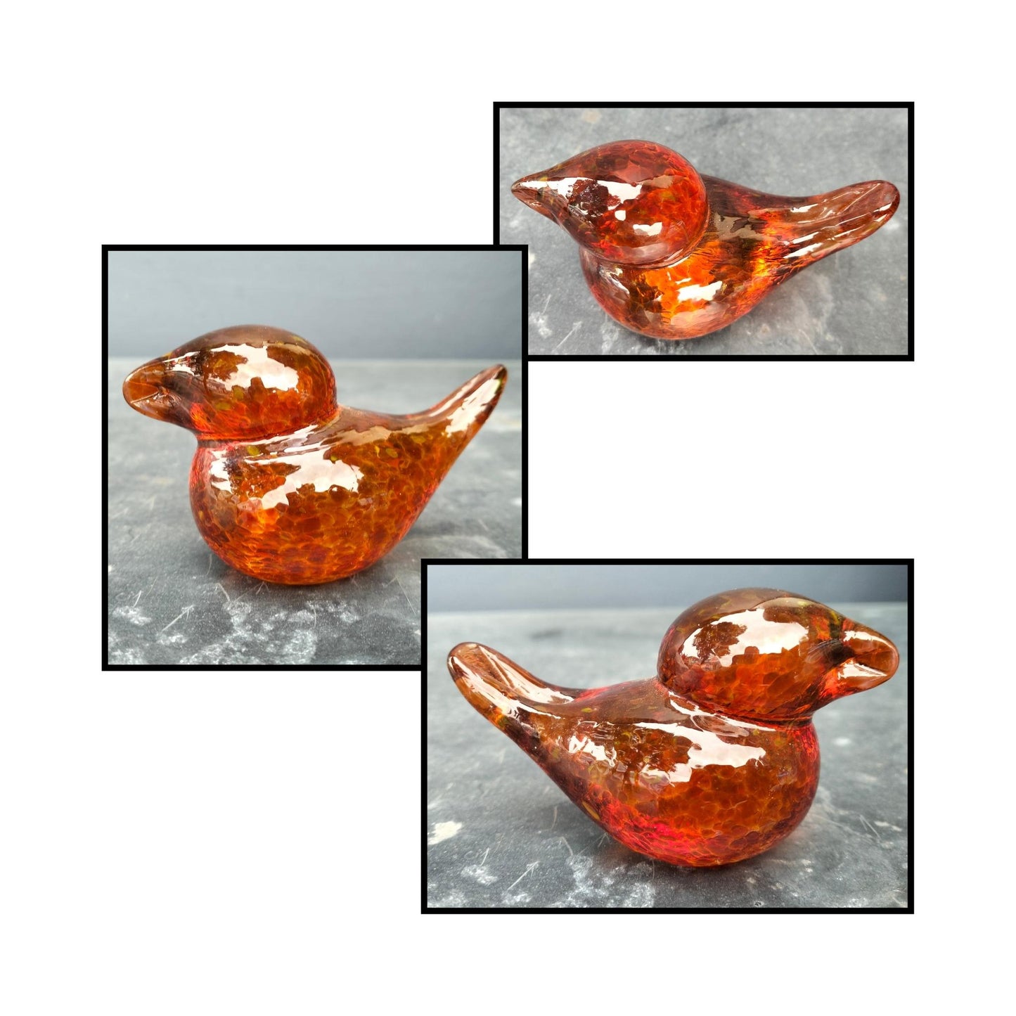 Handblown dark amber glass bird by Heather Kremen with smooth curves and glossy finish