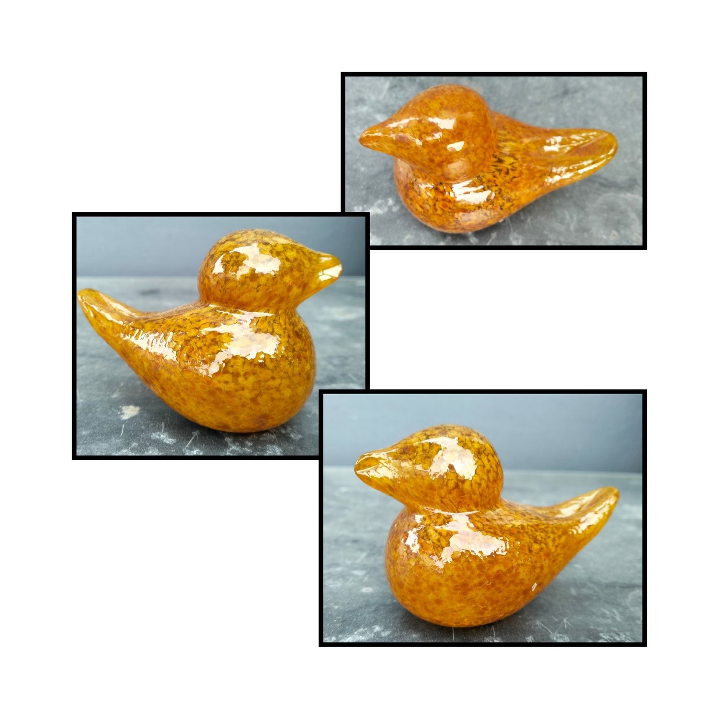 Orange and amber-toned glass bird sculpture by NZ artist Heather Kremen.