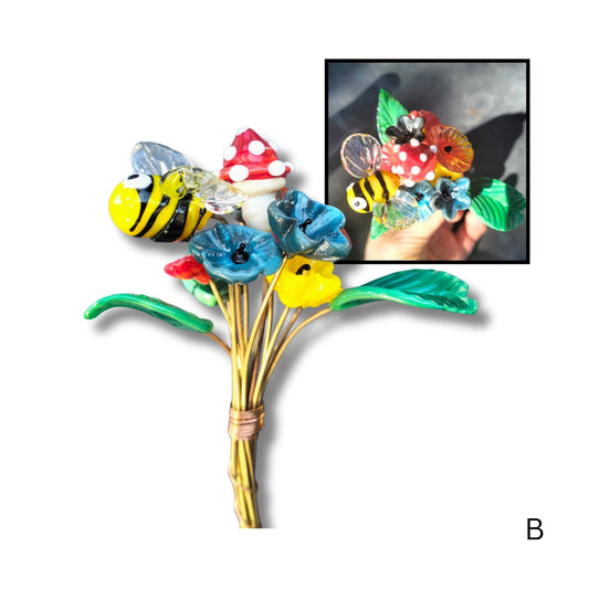 Glass bouquet B with spotted mushroom, blue, yellow bloom, red spotted mushroomand green leavess