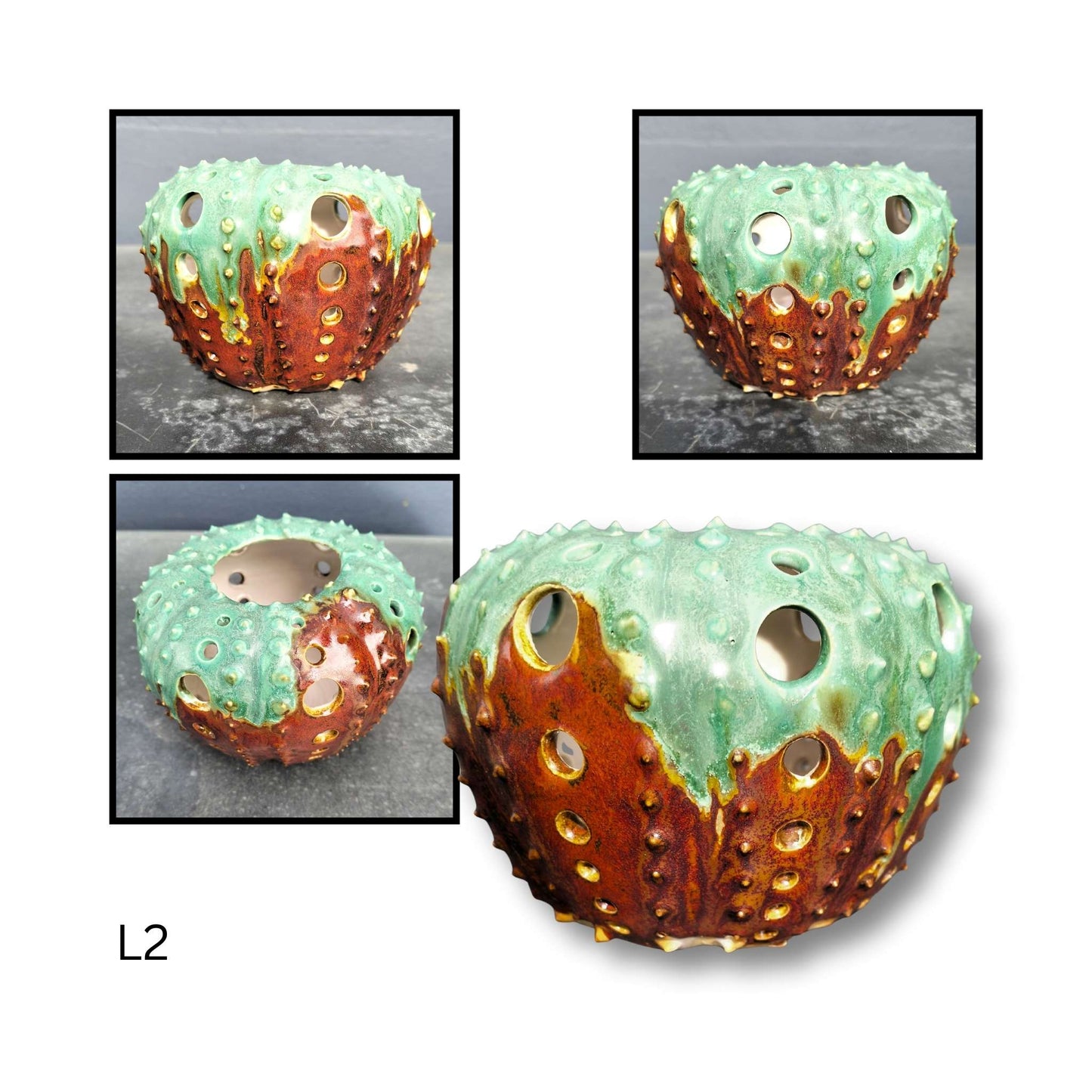 Decorative ceramic sphere with textured surface and metallic accents on a white background.