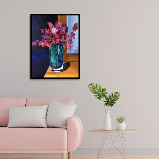 Floral still life of sweet peas in a clear vase, shown in a softly lit interior — evoking warmth, nostalgia, and everyday beauty.
