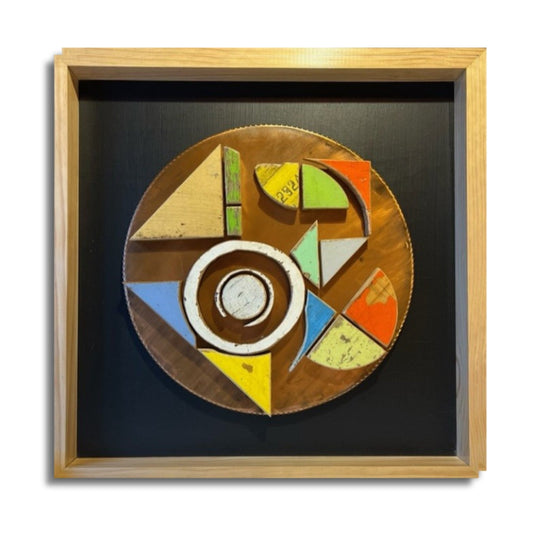 Pop by Lee Pritchard – circular artwork made from reclaimed beehive wood with copper base, pine frame, and black mat surround