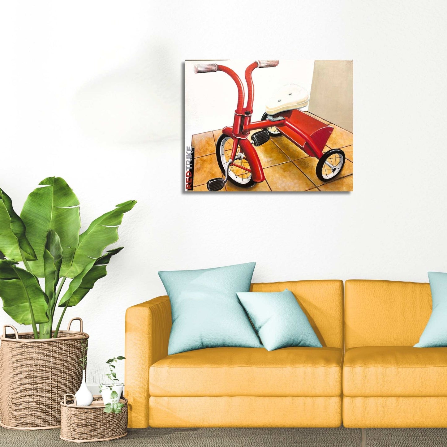 Living room with yellow sofa, blue pillows, and a Red Trike painting by David Jung – nostalgic childhood artwork.