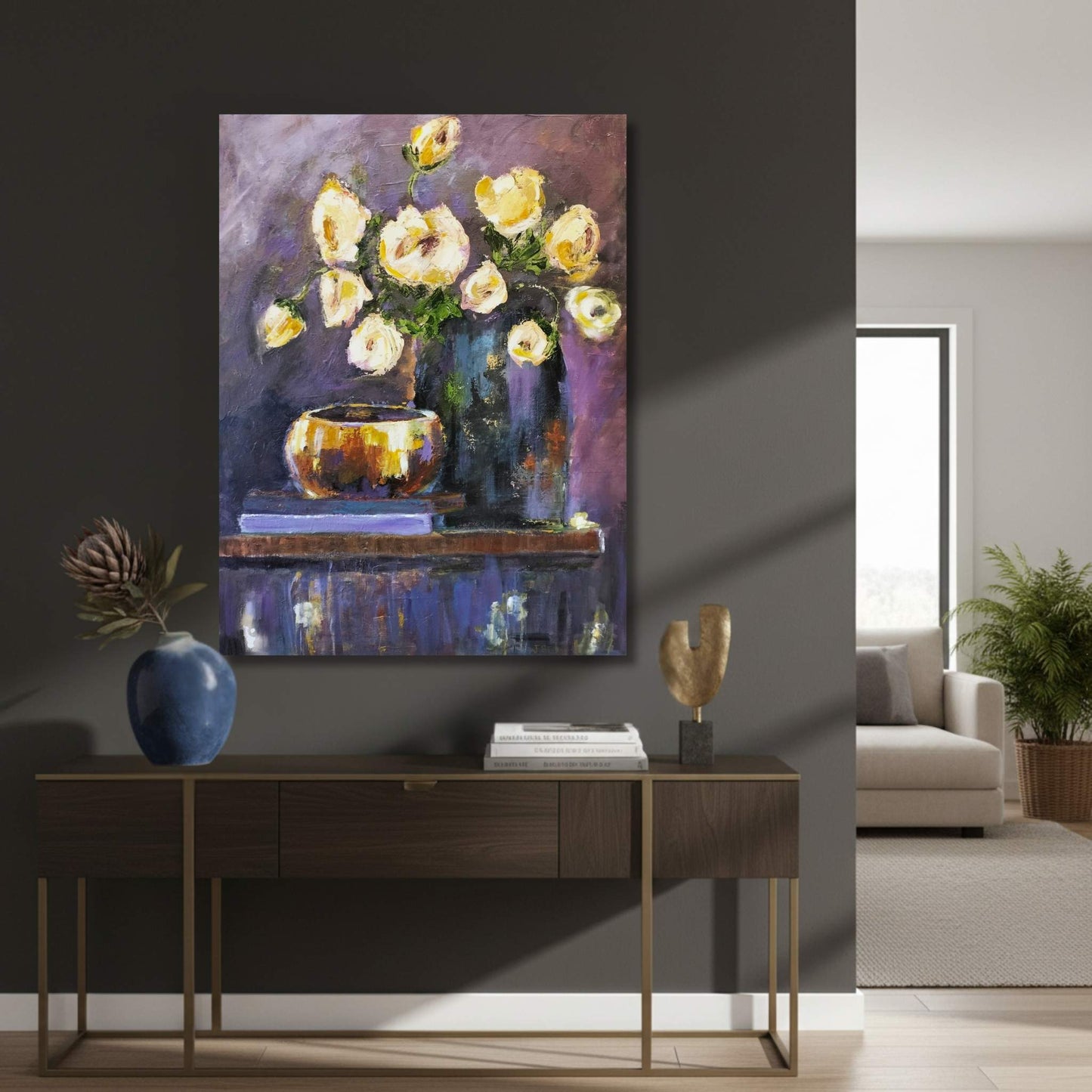 Floral painting on a wall above a wooden console table in a living room.