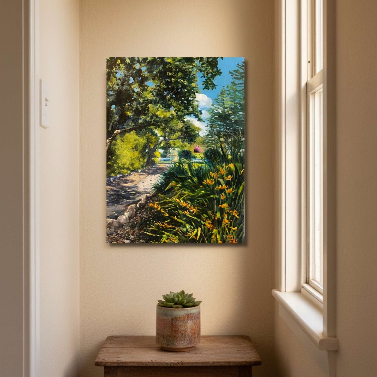 Small portrait oil painting of Napier's Marine Parade gardens by Bari Duncan displayed in a warm intimate home interior setting.