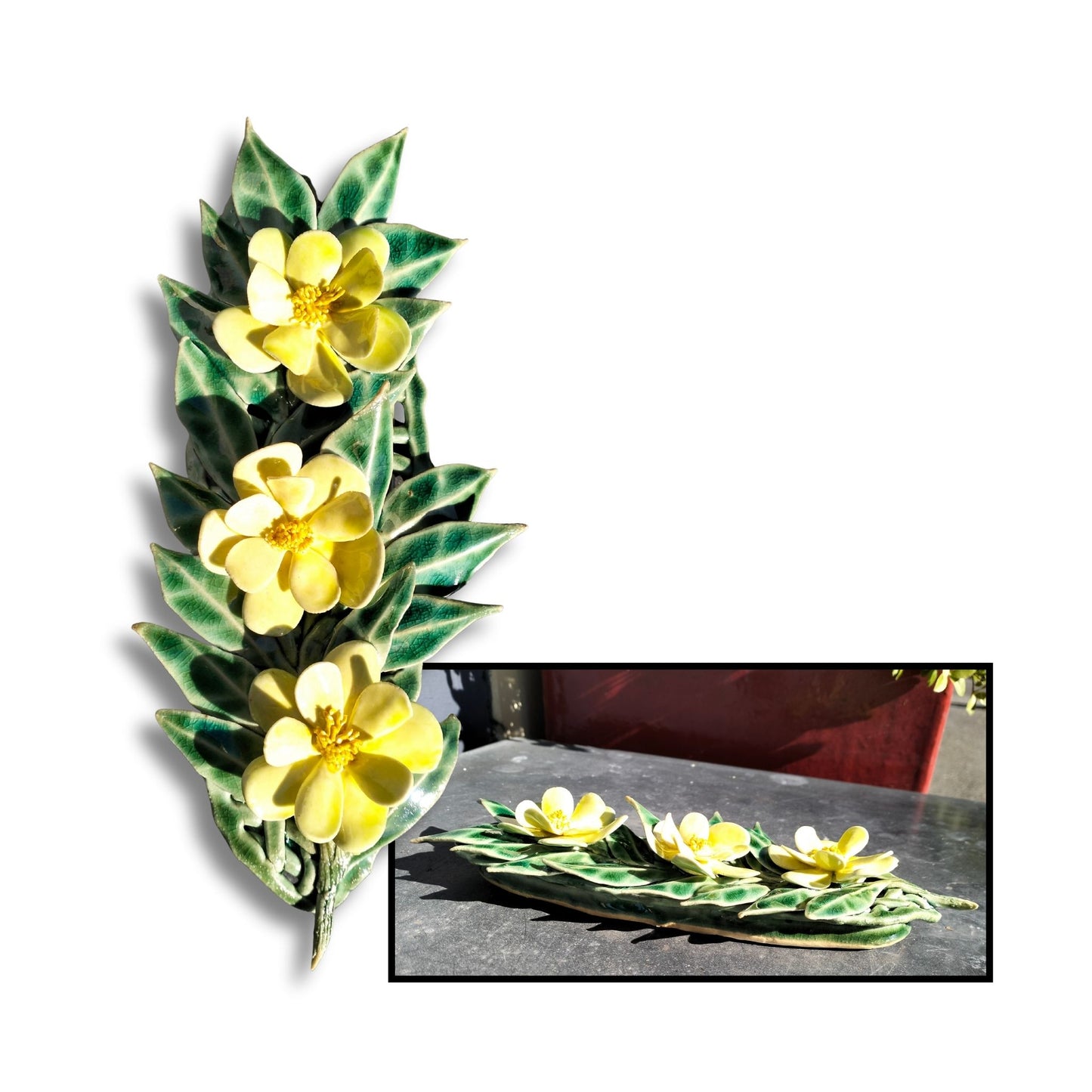 Bright yellow glazed camellia trio on textured leaf base, wall-hanging ceramic.