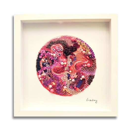 Framed abstract pink beaded embroidery artwork by artist Emily Richardson a white background