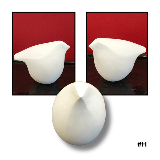 White Earthenware ceramic bird no.H sculpture on a red background