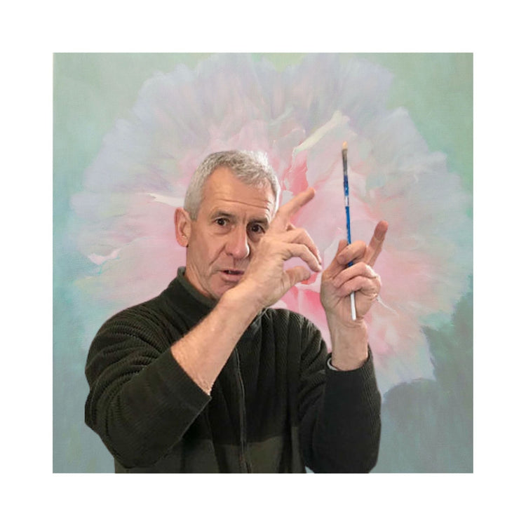 rent Redding, Hawke’s Bay artist, gesturing with a paintbrush in hand, sharing insights about his work.