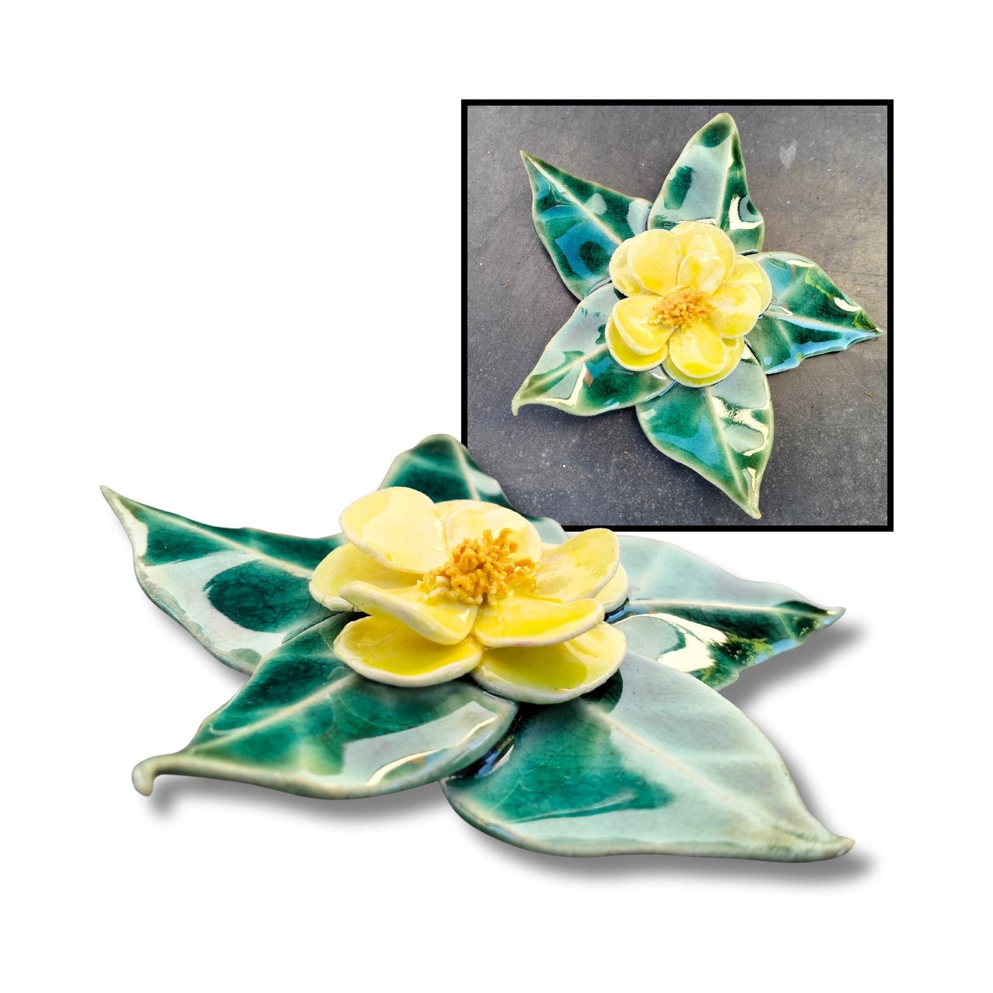 Yellow camellia wall-hanging ceramic with five green leaves, handmade by Tom Somerville.