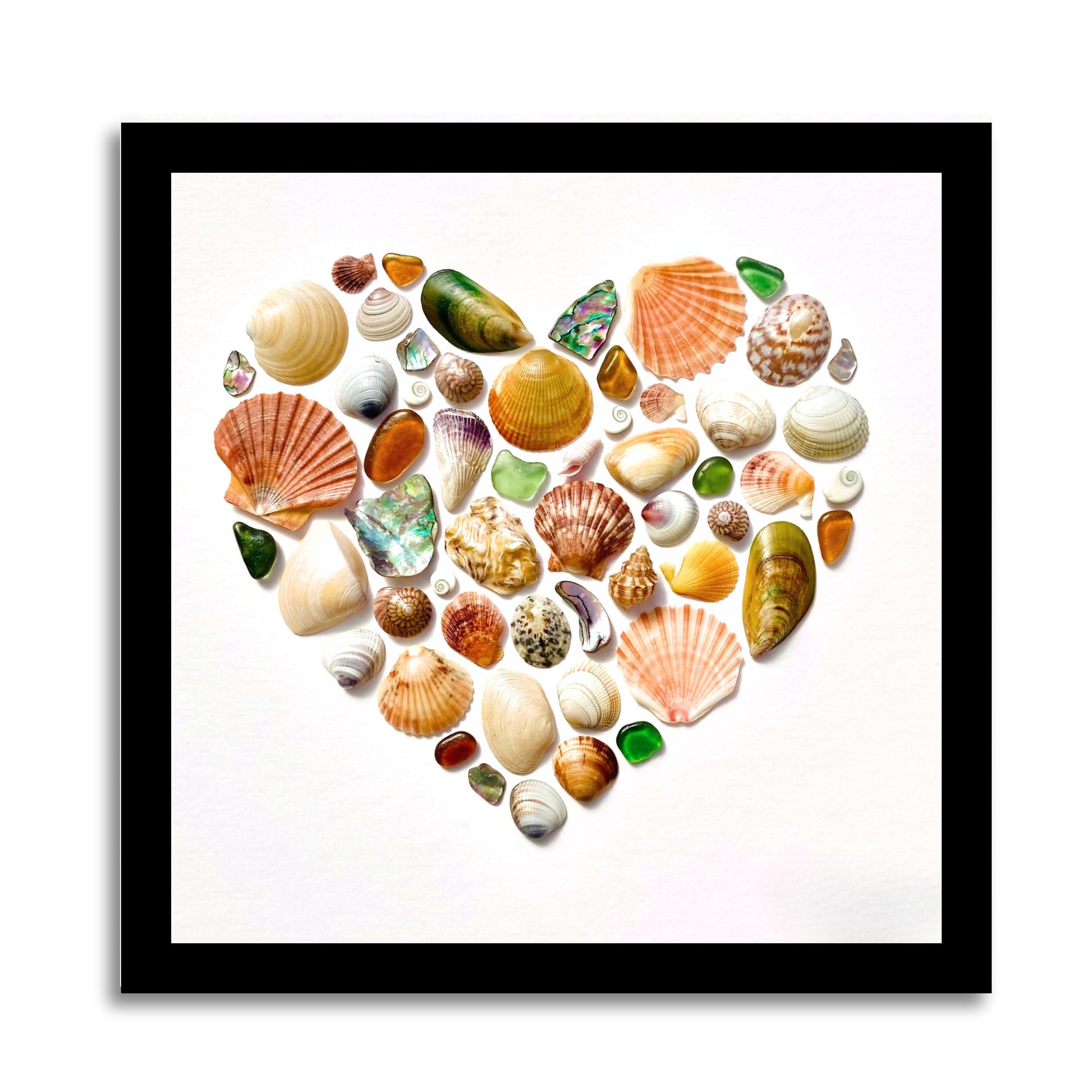 Heart-shaped sea glass and shell mosaic by Steffi Tregenna in soft greens, peach, and blues, framed in pale wood, titled NZ Sea Treasures Heart III.