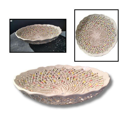 Intricate handmade ceramic lattice bowl by Tom Somerville with interwoven detail and colorful accents. Clay, 34 × 34 × 10cm. Sculptural craftsmanship and delicate beauty.
