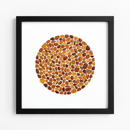 Amber sea glass art in black frame - front view by artist Steffi Tregenna
