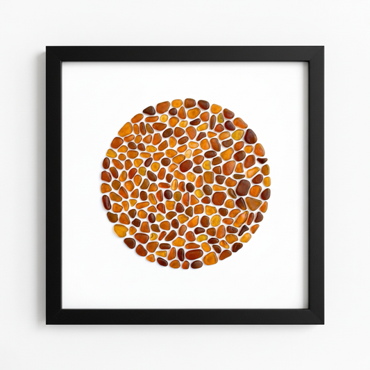 Amber sea glass art in black frame - front view by artist Steffi Tregenna