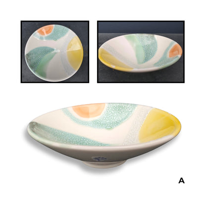 Brian Gartside B150  #A ceramic bowl featuring soft white glaze with turquoise, yellow and coral accents in organic flowing pattern
