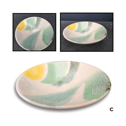 Brian Gartside B150  #C ceramic bowl featuring soft white glaze with turquoise, yellow and coral accents in organic flowing pattern