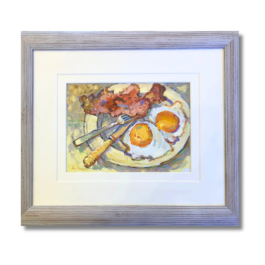 Framed original oil on board of bacon and two fried eggs on a plate with cutlery by Ion Brown, framed 51 x 43cm, titled Bacon and Eggs
