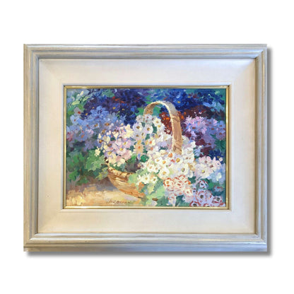 Framed original oil on board of a wicker basket overflowing with white and purple cineraria flowers by Ion Brown, framed 58 x 48cm, titled A Basket of Cinerarias
