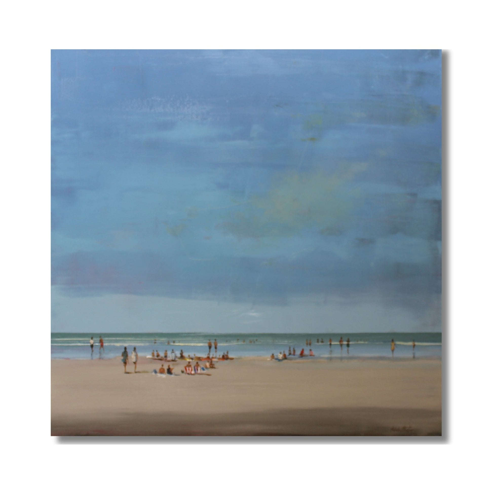 Beach Chill oil painting by Nicholas Hayter showing a serene beach scene with soft blue sky, turquoise water and people enjoying the shore, framed in white box frame
