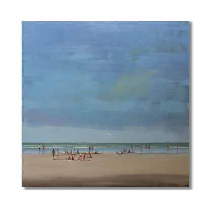 Beach Chill oil painting by Nicholas Hayter showing a serene beach scene with soft blue sky, turquoise water and people enjoying the shore, framed in white box frame
