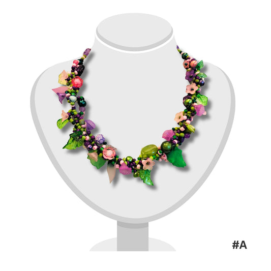 Delicate beaded necklace by Judith Bradley with carefully placed beads on a 52cm chain, photographed on white background