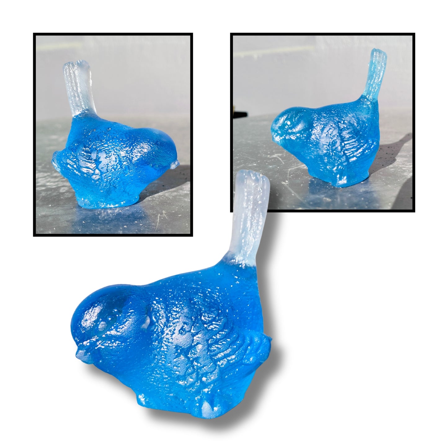 Small cast glass bird sculpture in blue with tail up by Lou Mathieson, 5x4x5cm, on white background
