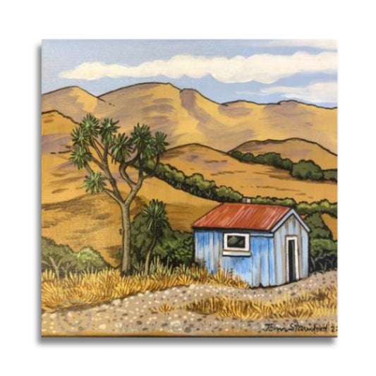 Blue Shed by John Staniford – acrylic painting reflecting New Zealand rural life, rustic shed, native tree, and warm landscape tones.
