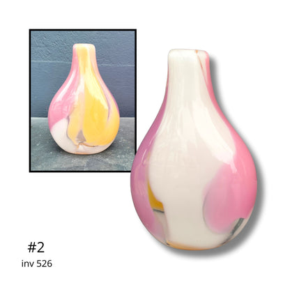 Decorative vase with pink and yellow gradient on a white background
