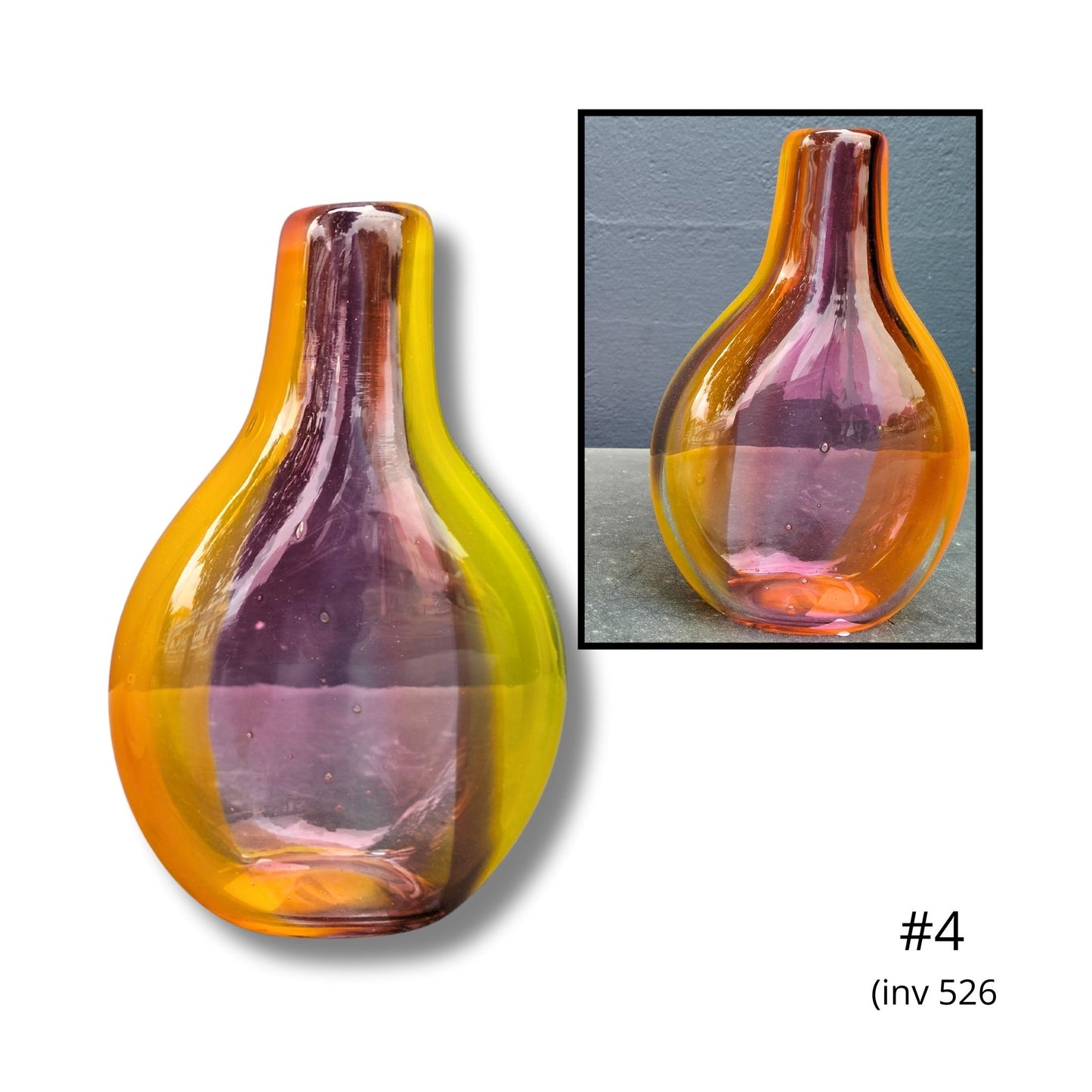 Glass vase with gradient color in a display setting