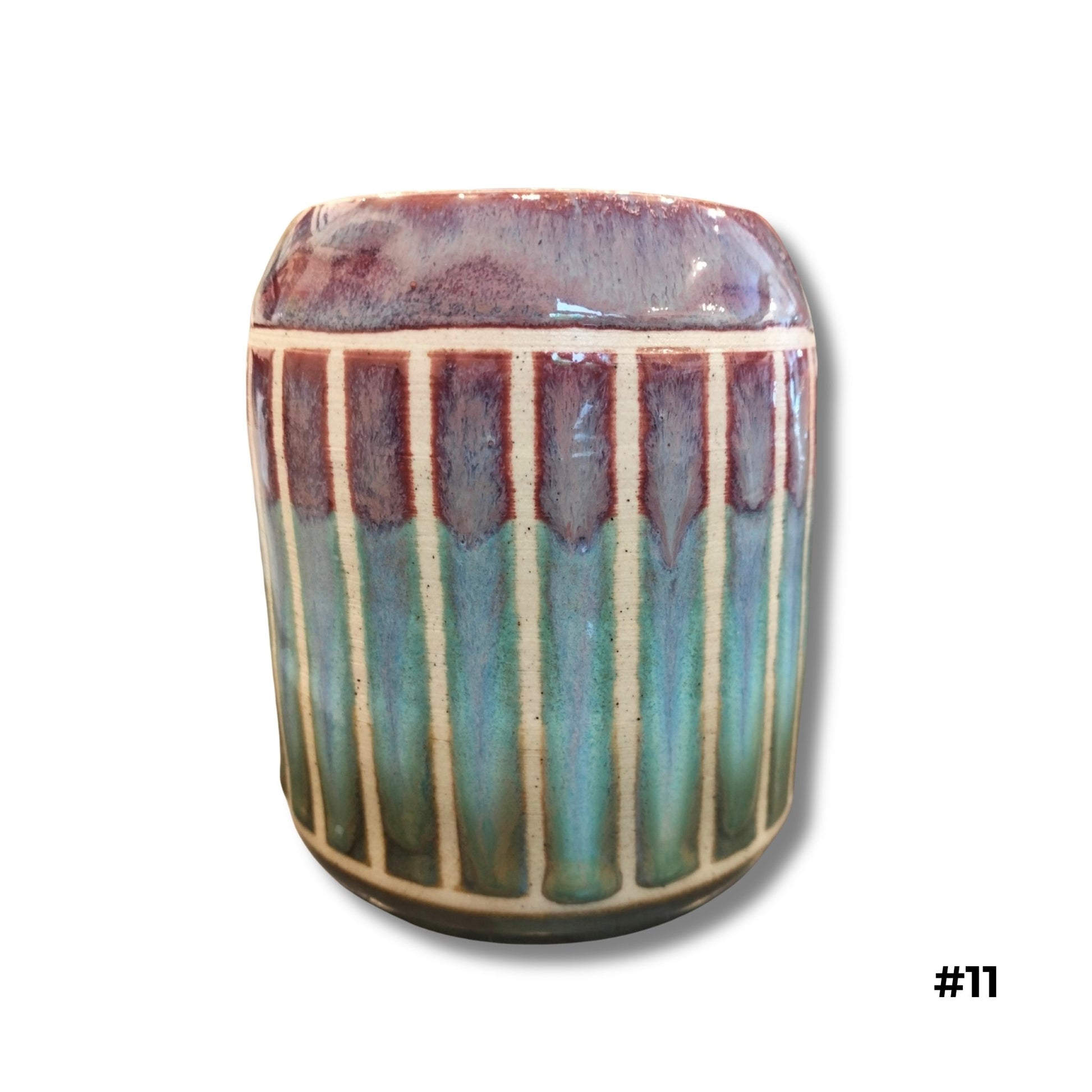 Teal and plum carved ceramic vase with vertical hand-carved lines and dripping glazes by Karene Fairey
