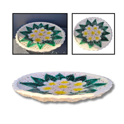 Handmade ceramic Frangipani Platter by Tom Somerville with white flowers, yellow centers, and green leaves on scalloped edge
