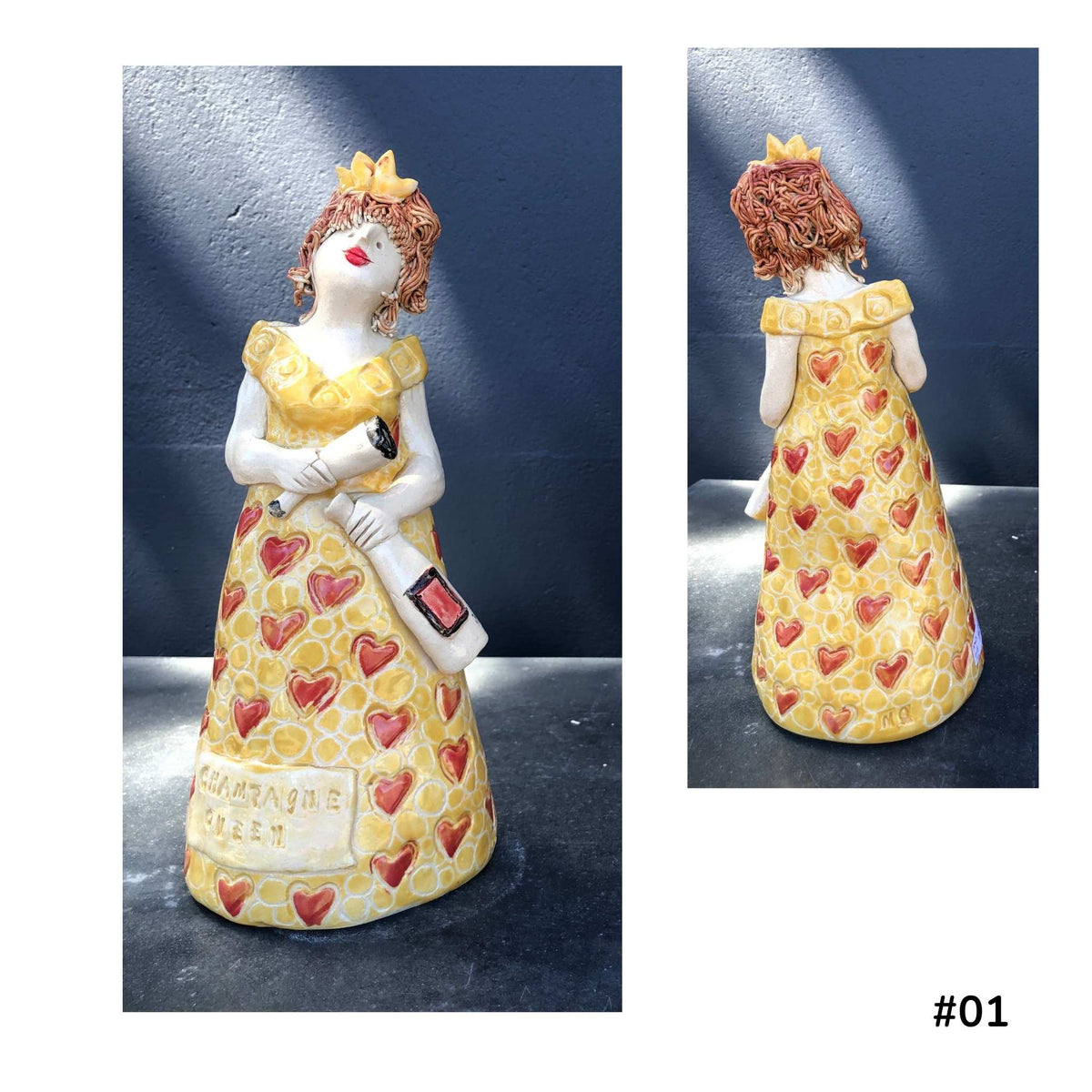 Mandy Olson’s ceramic lady 01, with red hair, a yellow dress with red heart vshape pattern, she is holding a wine glass and a bottle of wine, shown from the front and back.