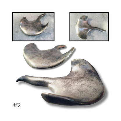 Medium ceramic stingray sculpture by Storm Davenport featuring smooth curves and ocean-inspired form