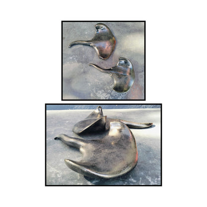 Ceramic stingray sculpture by Storm Davenport showing flowing form and graceful curves in neutral clay tones