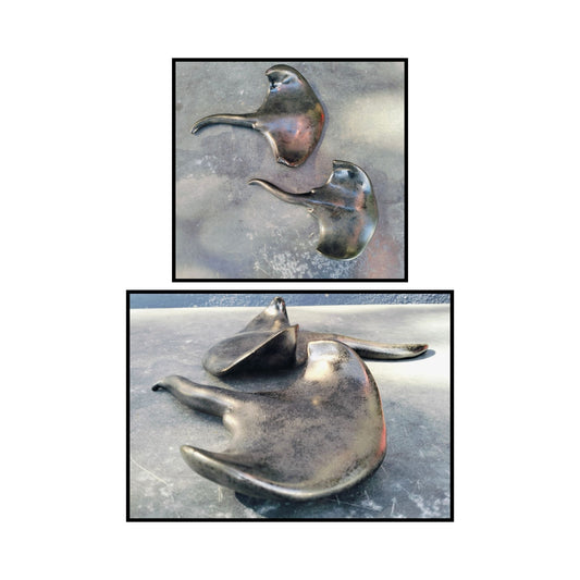 Ceramic stingray sculpture by Storm Davenport showing flowing form and graceful curves in neutral clay tones