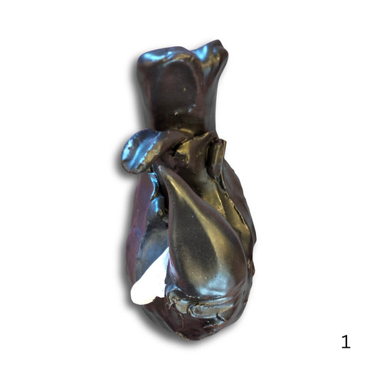 Hand-sculpted ceramic wall Tui 1 by Kylie Matheson, black glaze with white tuft, ready to hang