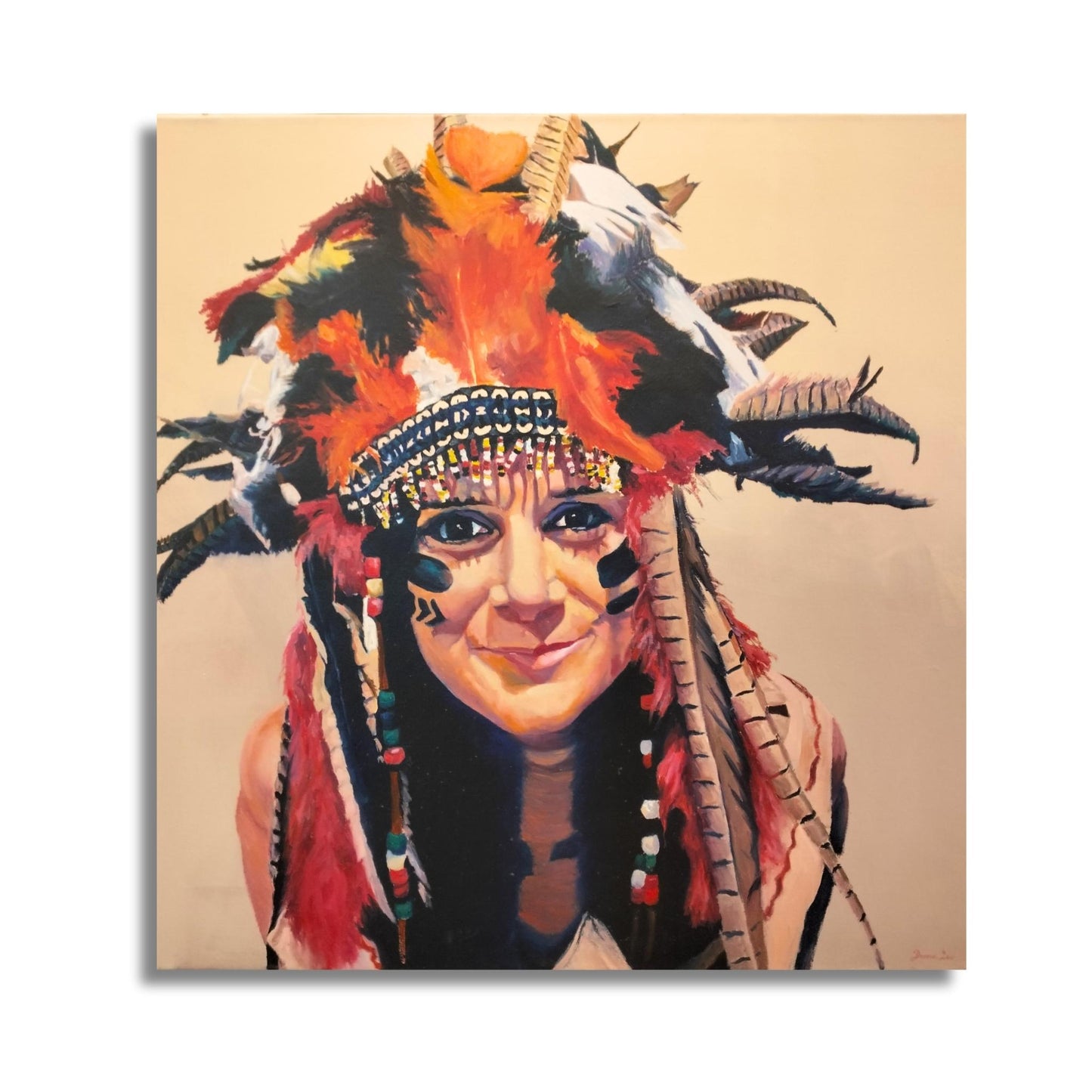 Vibrant portrait painting titled Cheeky Chief by Donna Lee featuring elaborate feathered headdress in orange and blue, intricate face paint, and joyful expression in acrylic and oil on canvas