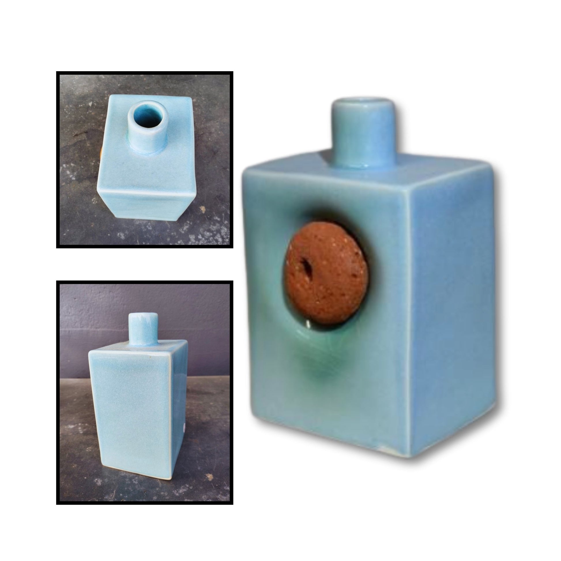 Handmade stoneware vase by Greg Melville with chun blue glaze and a recessed round brick fragment on the front.