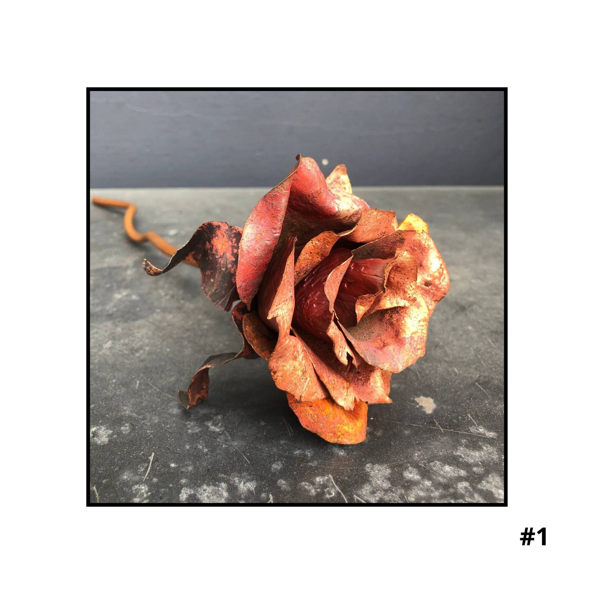 Handcrafted copper rose sculpture #1with layered petals in coral and bronze tones on white background