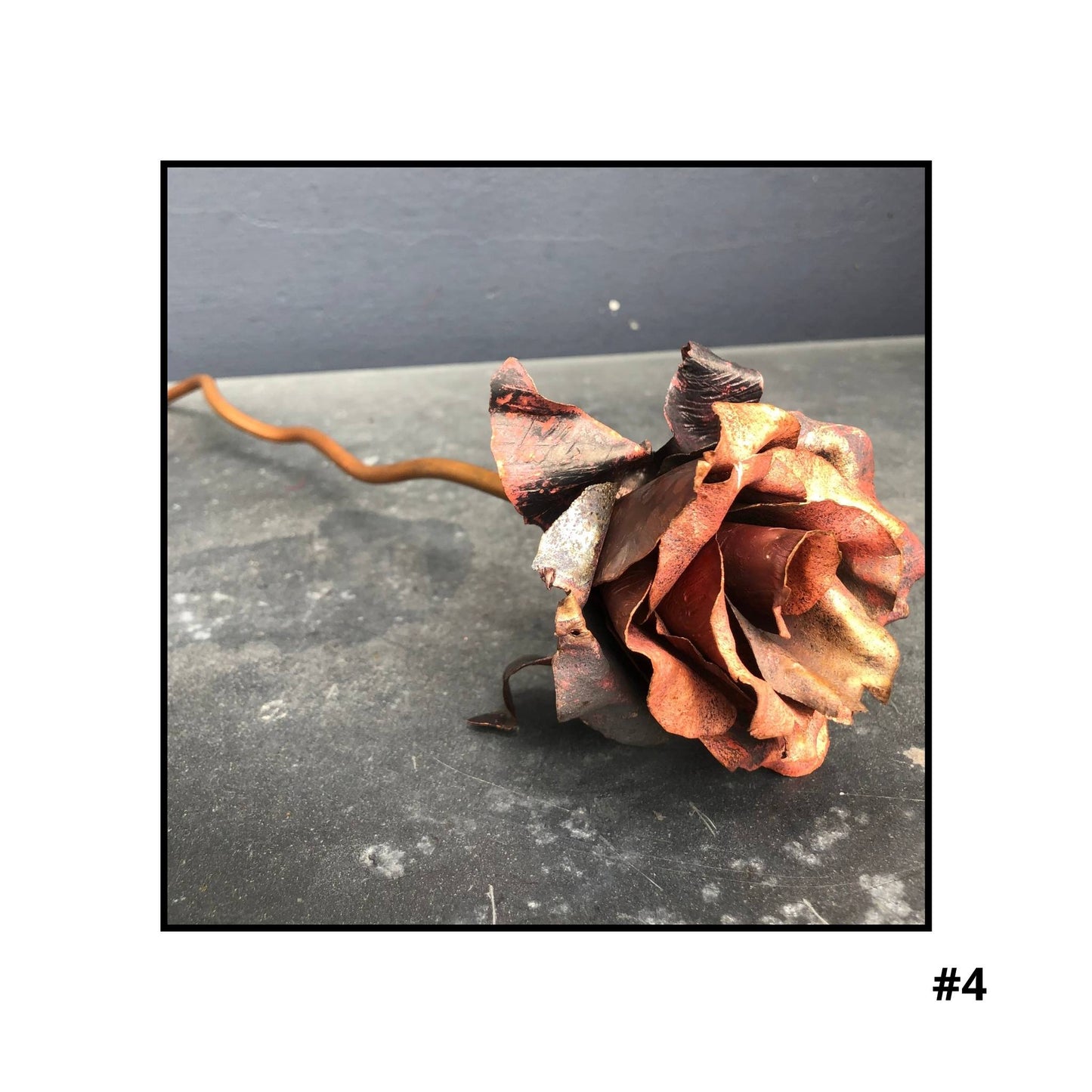 Handcrafted copper rose sculpture  #4 with layered petals in coral and bronze tones on white background