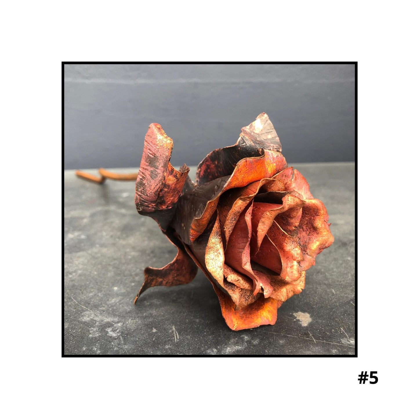 Handcrafted copper rose sculpture #5 with layered petals in coral and bronze tones on white background