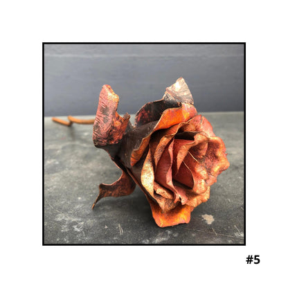 Handcrafted copper rose sculpture #5 with layered petals in coral and bronze tones on white background